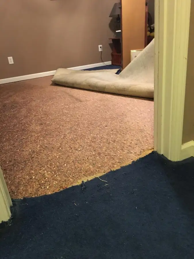 Carpet pad removal revealing water damage during Water Mitigation Services in Truckee